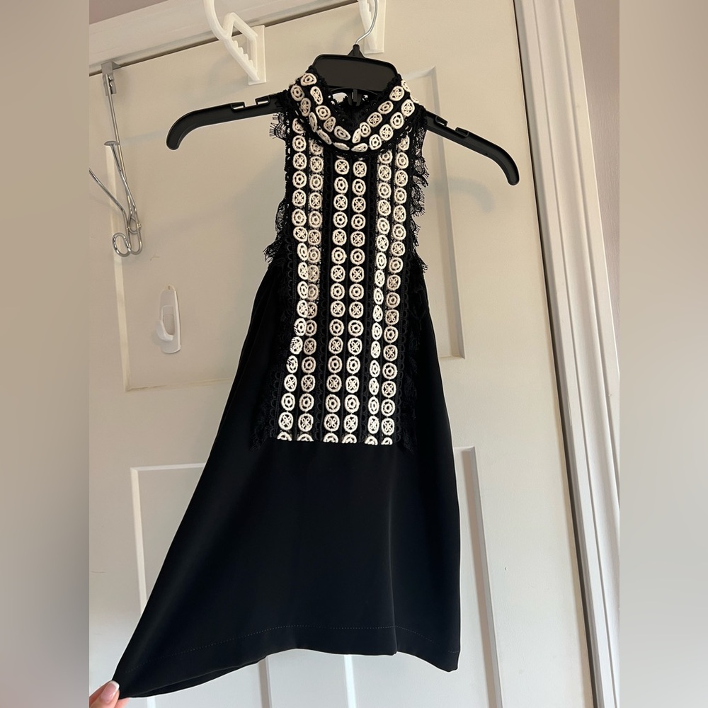 Yigal Azrouël black high neck detailed top.